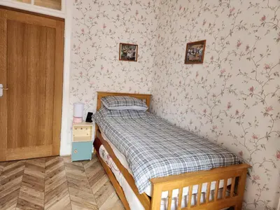a small bedroom with a bed in a room at Apartment - Largs - Sleeps 4 - Pet Friendly in Largs