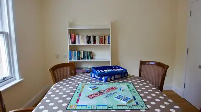 a dining room table with a cola box on it at Fire Station Cottage in Comrie