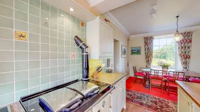 a kitchen with a sink and a counter top at Airds of Kells House in Castle Douglas