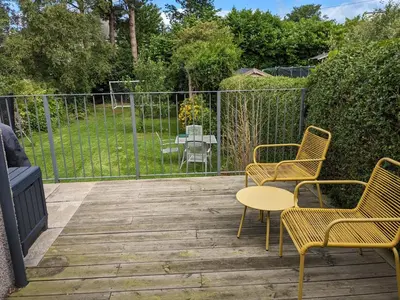 a patio with chairs and a table and a table and chairs at Private room with terrace and free parking in Edinburgh
