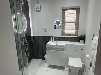 a bathroom with a toilet and a sink and a shower at Premium executive Apartment in Dunfermline in Dunfermline