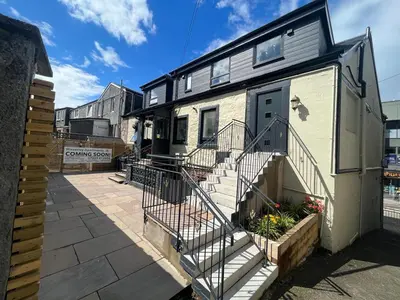 a house with stairs leading to the front of it at Waverley Apartments, Crow's Nest in Gourock