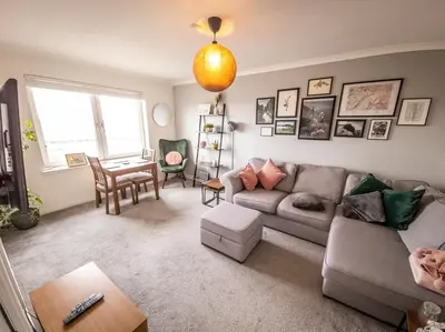 a living room with a couch and a table at Tranquil 2Bed/2Bath Duplex Falkirk in Falkirk