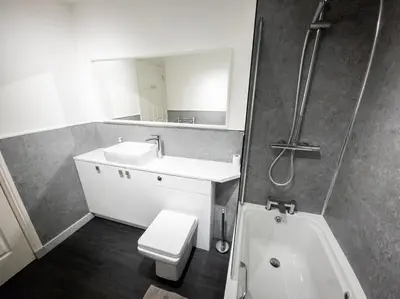 a bathroom with a sink and a toilet and a shower at Tranquil 2Bed/2Bath Duplex Falkirk in Falkirk