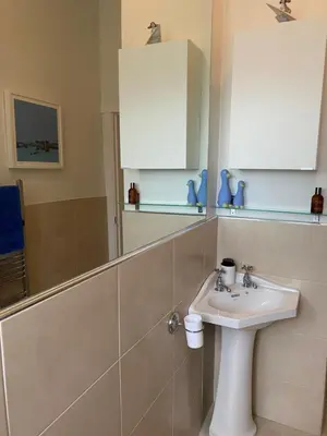a bathroom with a sink and a mirror at Tranquil Haven Murrayfield in Edinburgh