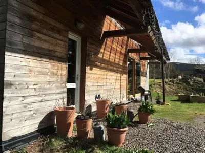 a group of potted plants sitting outside of a house at Beautiful Award-Winning Rural Home in Dolphinton