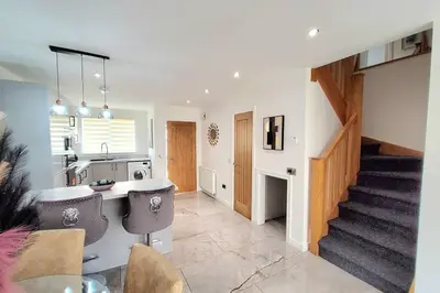 a kitchen and living room with a staircase in a house at Three Bedrooms House By Sensational Stay Short Lets & Serviced Accommodation With Free Parking & Wi-fi in Ballingry