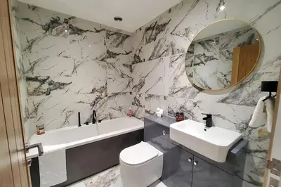 a bathroom with a sink and a toilet and a mirror at Three Bedrooms House By Sensational Stay Short Lets & Serviced Accommodation With Free Parking & Wi-fi in Ballingry