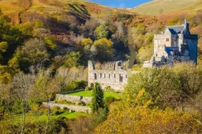 an old castle on a hill in a field at Rivers Edge in Dollar