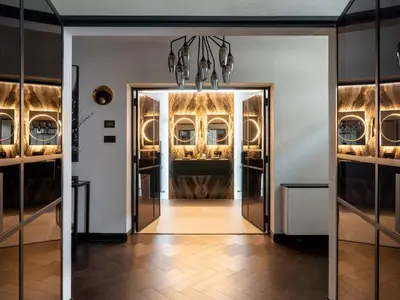 a hallway with a door leading to a dining room at Luxury Romantic West-End Apartment With Jacuzzi Spa Bath in Edinburgh