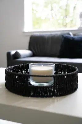 a black tray with a candle on a table at 2 BDR Apt By Caledonia Luxe Stays Short Lets & Serviced Accommodation Airdrie in Airdrie