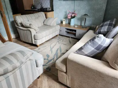 a living room with two chairs and a couch at Largs holiday flat in Largs