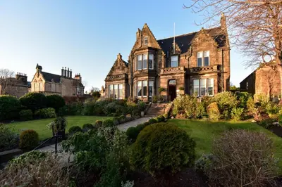 an old house with a garden in front of it at The Roseate Edinburgh - Small Luxury Hotels of the World in Edinburgh