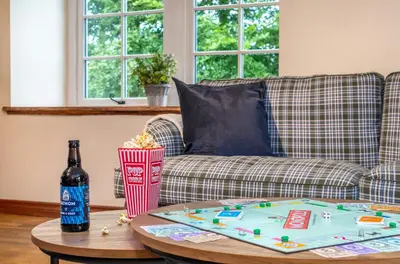 a table with a tray on top of a couch at The Jaw Barn in Milngavie