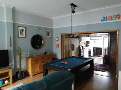 a living room with a pool table in it at Aigas in Glasgow