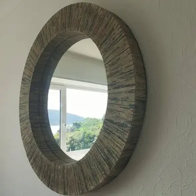 a round mirror on a wall with a window at Peaceful and Stunning Waterside Location in Helensburgh
