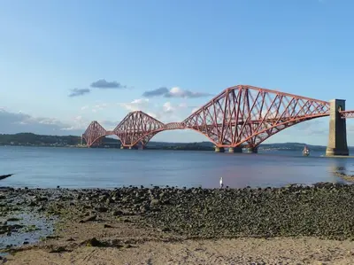 a bridge over a body of water with birds on the shore at The Nook, Studio Apartment, South Queensferry in Queensferry