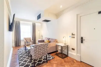 a living room with a couch and a table at King Street Aparthotel in Stirling