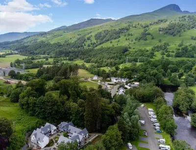 an aerial view of a village in the hills at The Heathers in Killin