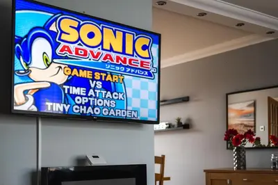 a television hanging on a wall in a living room at The Brigg in Coatbridge