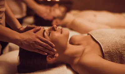 a woman getting a massage at a spa at Forest Corner Luxury Home with Hot Tub in North Ballachulish