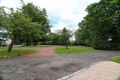 a dirt road in a park with trees at Woodhead view in Kirkintilloch