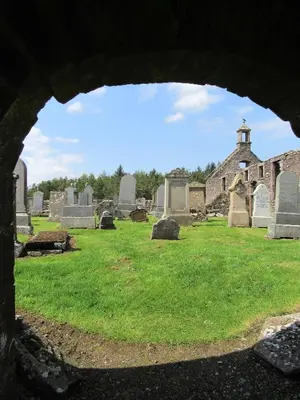 a view of a cemetery through a window at Middleton House Bed and Breakfast in Auchterarder