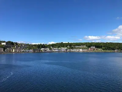 a large body of water with a town in the background at Argyle House in Rothesay