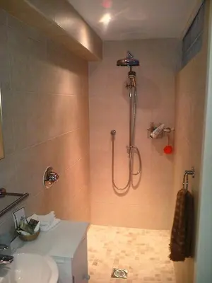 a bathroom with a shower and a sink at Langside in Stirling