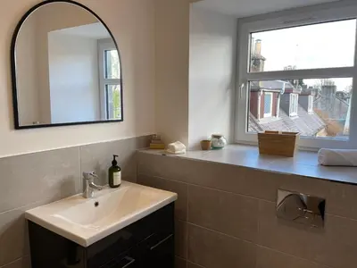 a bathroom with a sink and a window at Stunning Apartment in Callander in Callander