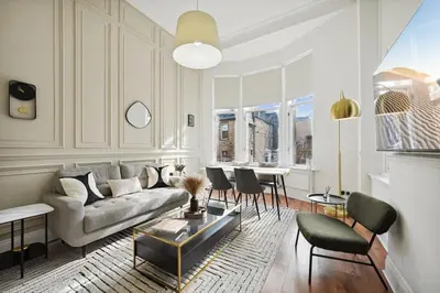 a living room with a couch and chairs and a table at (G3) Grand 2 bed Blythswood Apartment in Glasgow