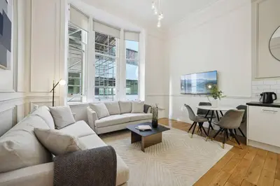 a living room with a couch and a table at (G4) Luxurious 2 Bed Blythswood Flat in Glasgow