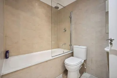 a bathroom with a tub and a toilet and a shower at (G4) Luxurious 2 Bed Blythswood Flat in Glasgow