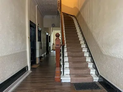 an empty hallway with stairs in a building at Cozy Studio Apartment of Glasgows West End in Glasgow