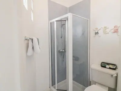 a bathroom with a shower and a toilet at The Old Rectory in Largs