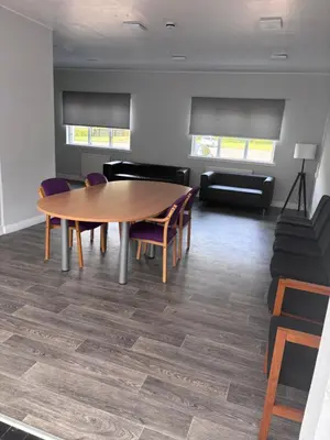 a dining room with a table and chairs at Garnock 3 in Beith