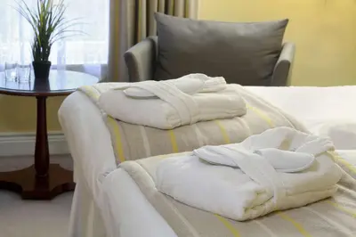 two towels on a bed in a hotel room at Best Western Plus Dunfermline Crossford Keavil House Hotel in Dunfermline