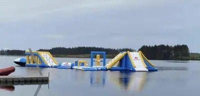 a row of inflatable slides on a body of water at Newton Stewart-Sleeps 6-Pool-Parking-Pet Friendly in Newton Stewart