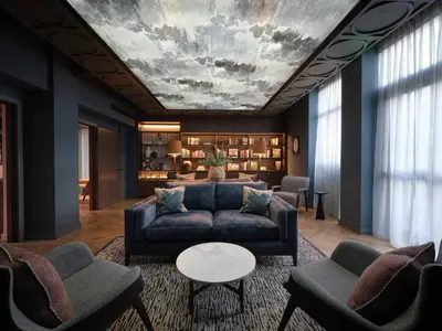 a living room with a couch and a table at The Resident Edinburgh in Edinburgh