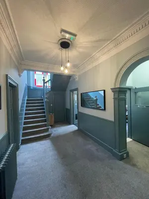 an empty hallway with stairs and a ceiling at King's Knoll Hotel in Oban