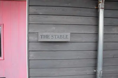 a sign on the side of a building at The Stable at Drumachro in Isle of Gigha