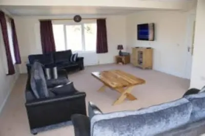a living room with couches and a coffee table at Glenview Salen in Salen