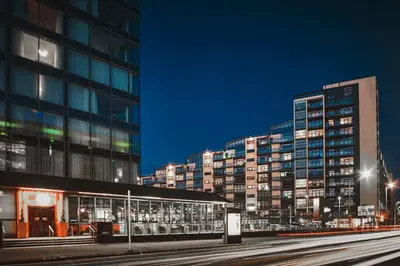 a city at night with tall buildings and a train station at Glasgow, Finnieston Luxury 2 Bed with parking, e-check in, hi-fi in Glasgow