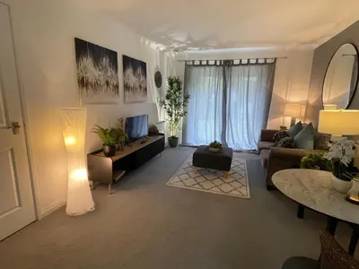 a living room with a couch and a tv at Gleneagles Rental in Auchterarder