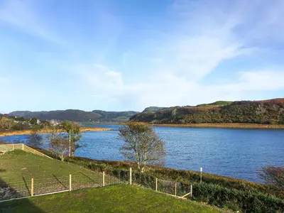 a view of a river with hills in the background at Tulamain in Ardfern