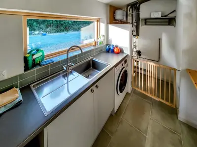 a kitchen with a sink and a window at Tulamain in Ardfern