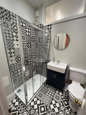 a bathroom with a shower and a sink at James Street 2 Bedroom Apartment in Stirling
