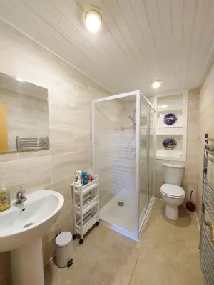 a bathroom with a shower and a sink and a toilet at The Octopus - at Largs Town Centre with Private Parking in Largs