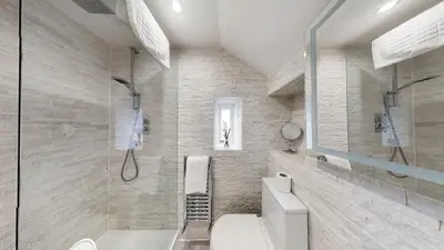 a bathroom with a toilet and a shower at Cameron North Lodge in Alexandria