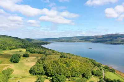 an aerial view of a lake with trees and water at Tarbert Country Manor in Tarbert